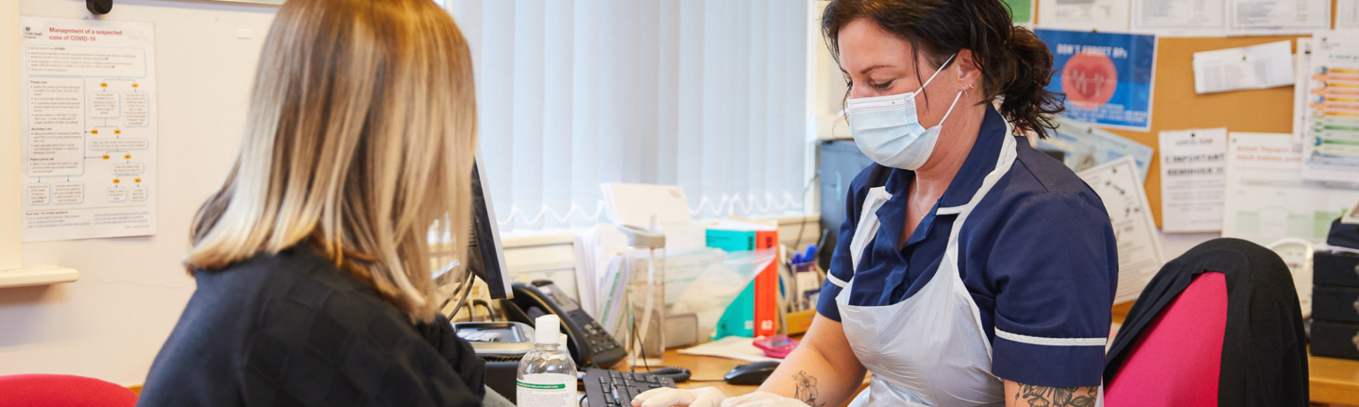 A photo showing a nurse checking a patients blood pressure