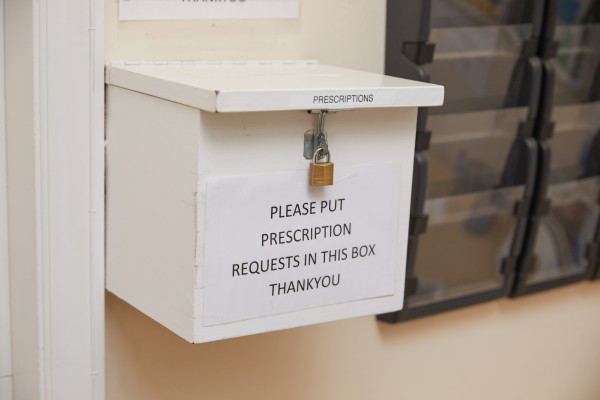 A photo showing a prescription drop box